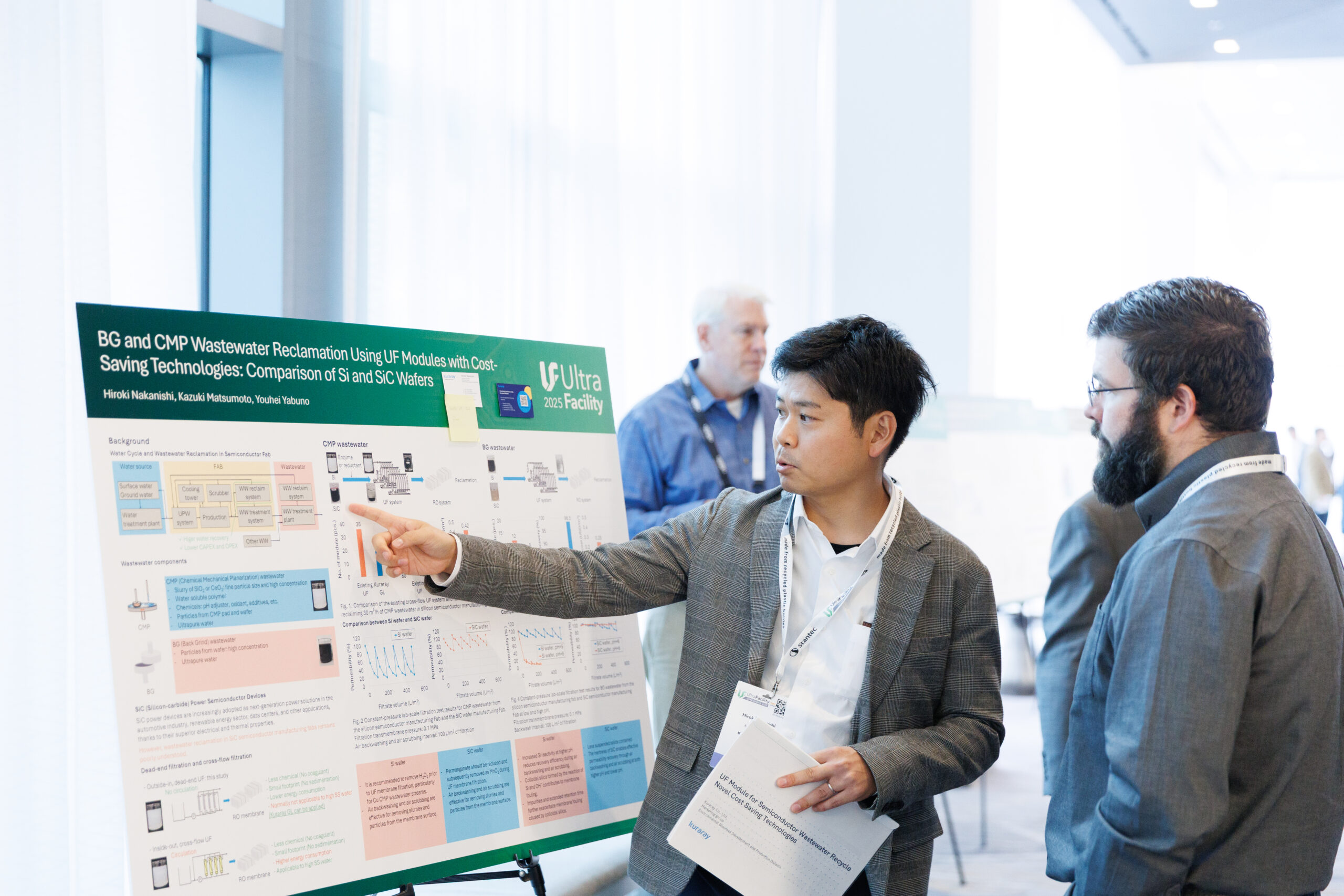 Delegates reading research posters in the UltraFacility exhibition hall